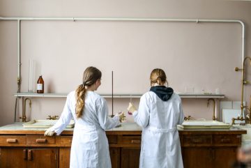 Canva - Women In White Laboratory Gown Standing